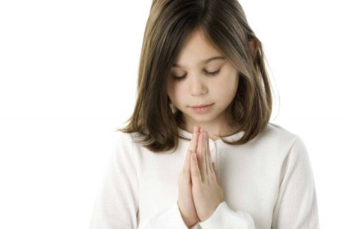 Girl praying Scripture