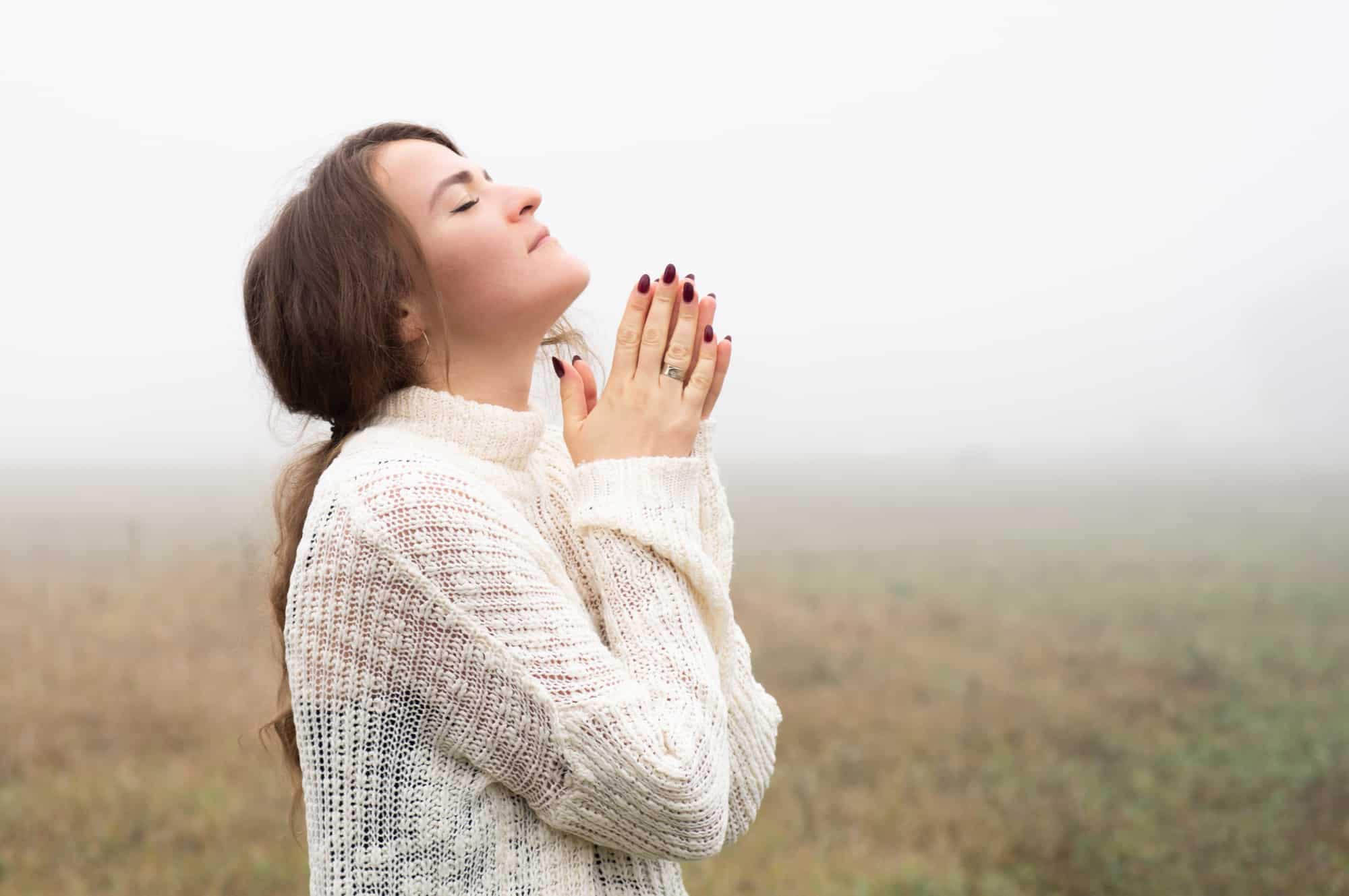 woman praying and looking to God