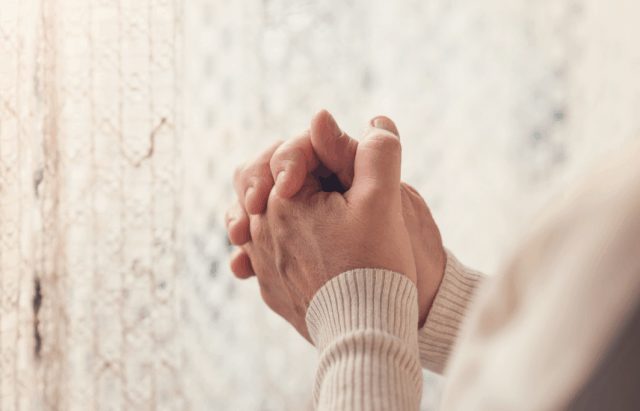 woman's praying hands