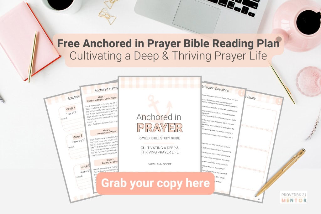 A feminine desk with computer, coffee cup and pot, plus the pages of the free Anchored in Prayer Bible Reading Plan